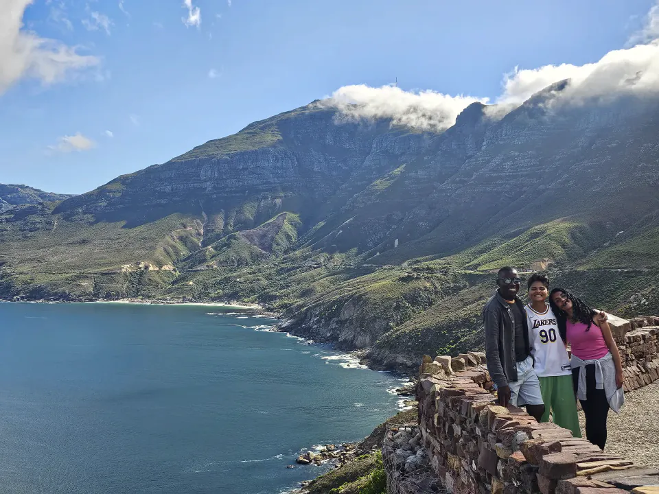Shepherd with two guests overlooking the Cape Peninsula coastline