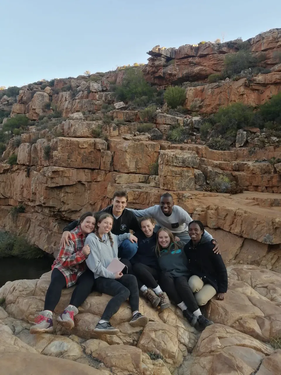 A private group relaxing together among Cape sandstone rocks